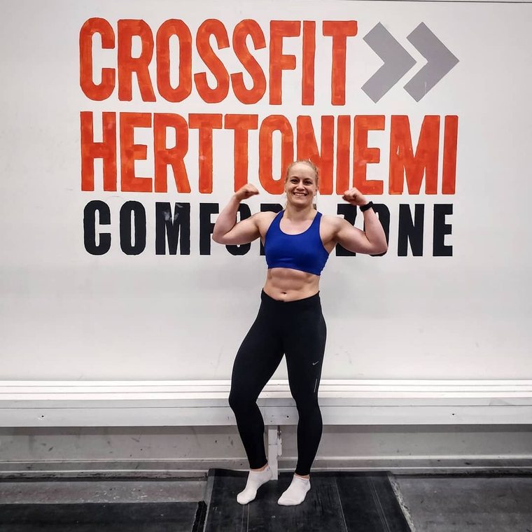 Aino on stage at a CrossFit competition, representing Finland